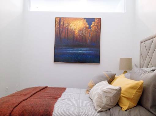 Bedroom with colorful artwork and decorative pillows at 68 Beale Apartments, Quincy, MA